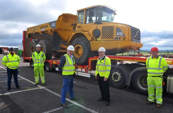 cork-airport-3 men in front of large truck prepping to install piping at cork airport in ireland