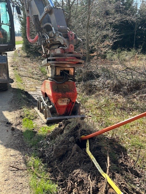 HDD_001 diggers installing pipework at the side of the runway at cork airport in ireland